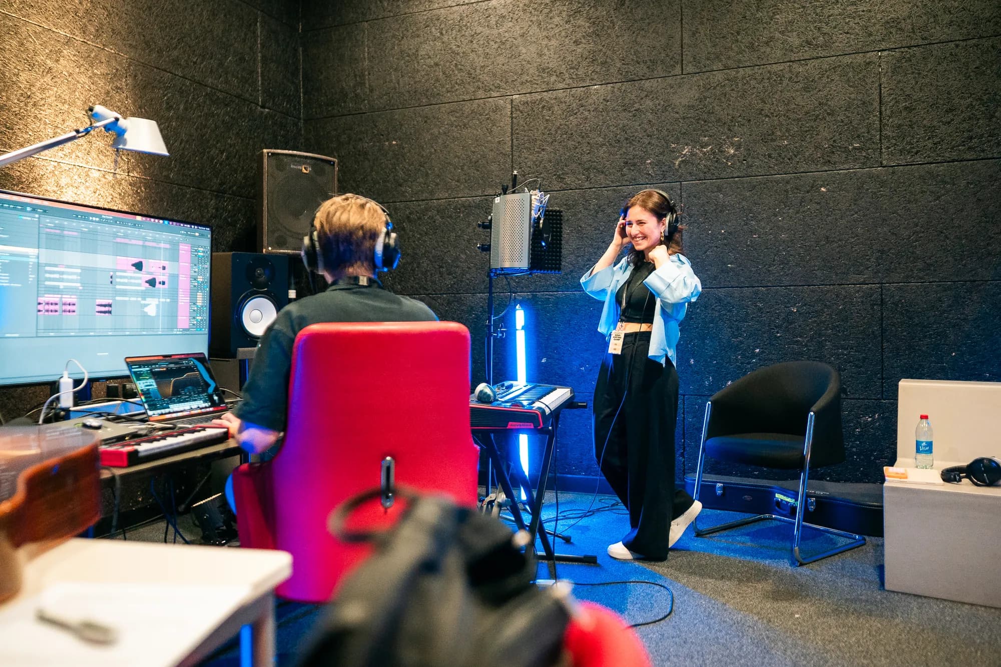 An artist preparing to record vocals with Remy Cooper in the studio