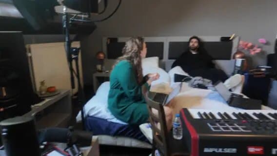 Artists and producers working together in a Belgium writing room