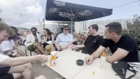 Songwriters sharing a table during a Malta writing camp