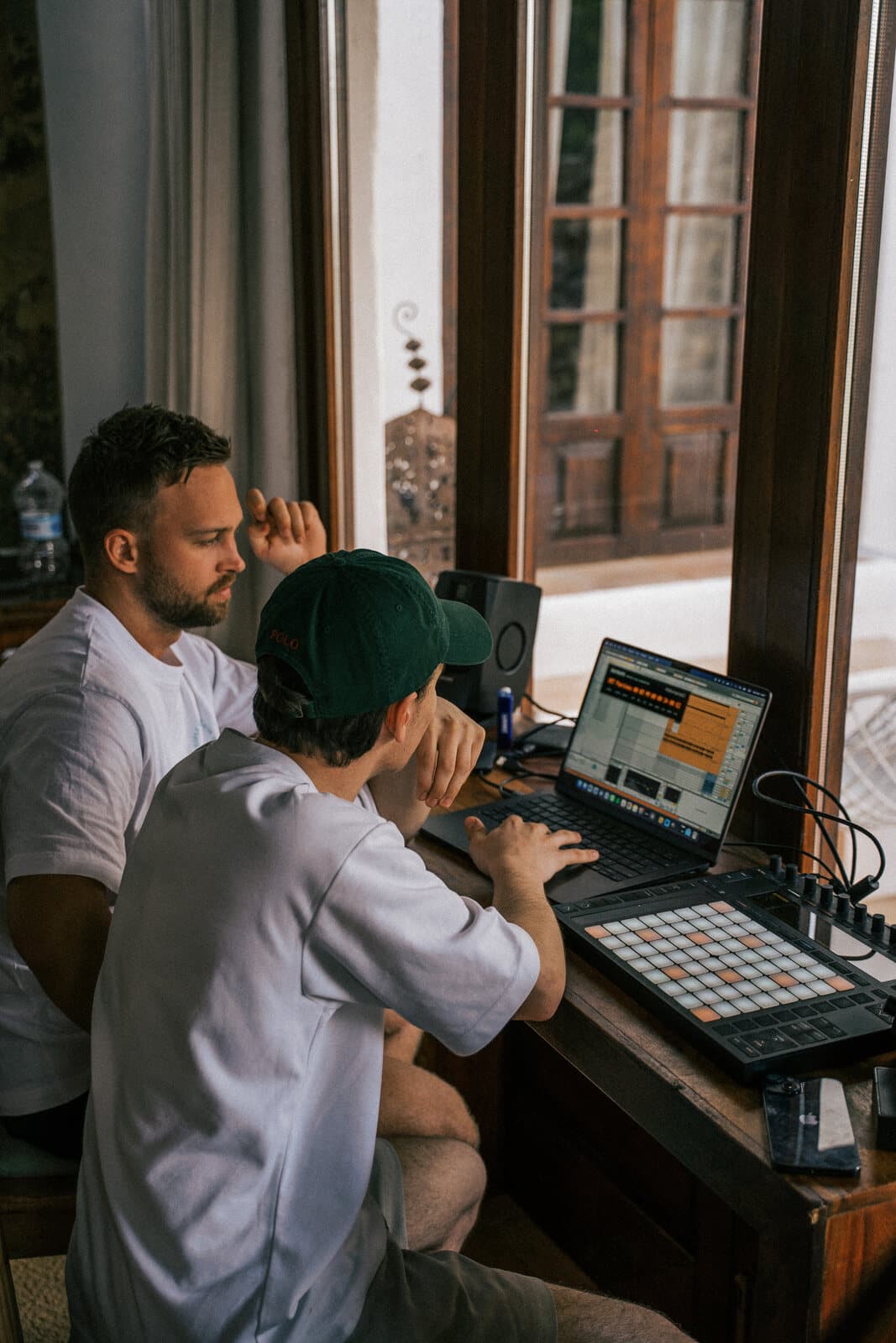 Collaborators shaping a song together in a writing room