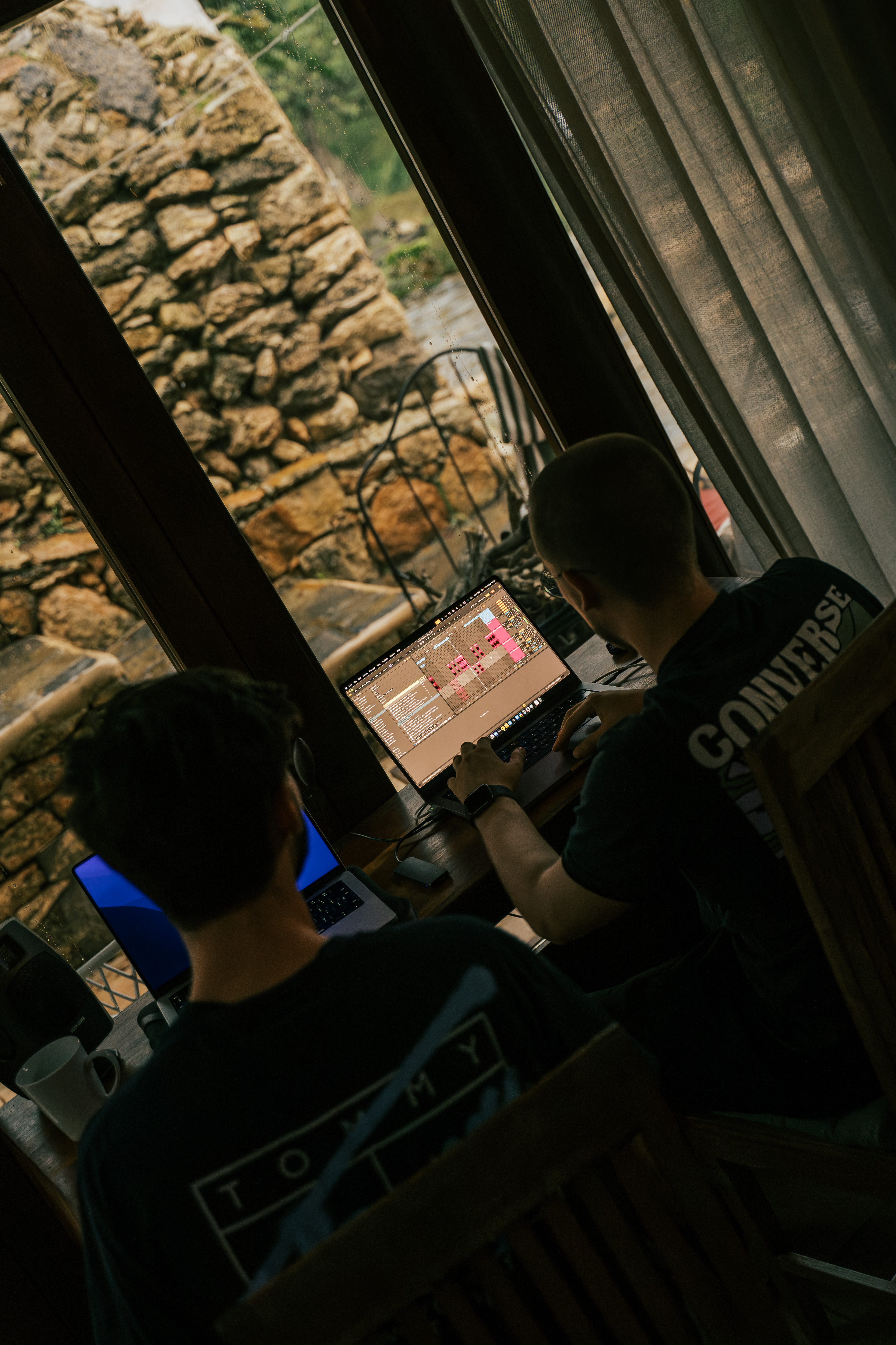 Two collaborators listening back to a production in Ibiza